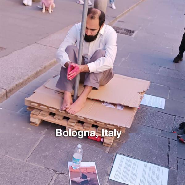 Bologna, Italy: Protester in support of tortured Iranian Khodanour.