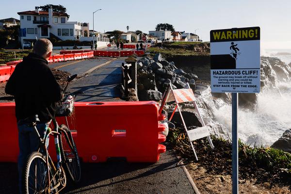 Barricades block off a crumbling section of West Cliff Drive in Santa Cruz, Calififornia, January 17, 2023.