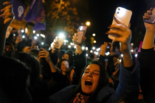 Turkey, IWD 2023, activists shout slogans and hold lighters