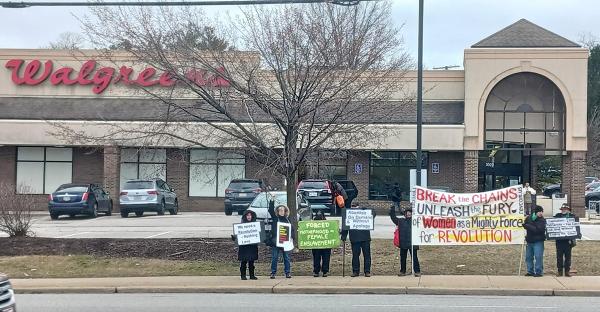 Cleveland, IWD 2023, protesters stand in front of Walgreens.