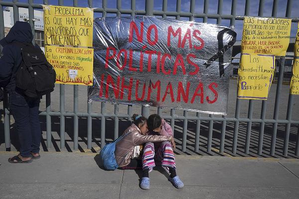 Venezuelan sisters outside immigration center where dozens of migrants were killed in fire.