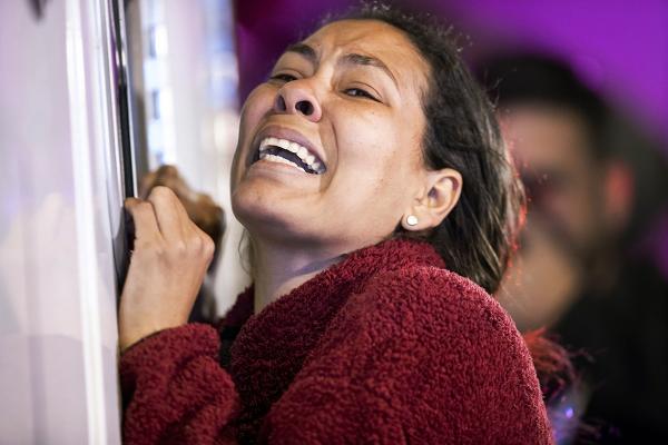 Woman distraught at Mexico detention center fire kills dozens, March 27, 2023.