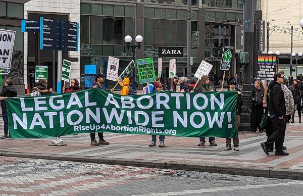 Seattle, banner against abortion pill ruling, April 8, 2023.