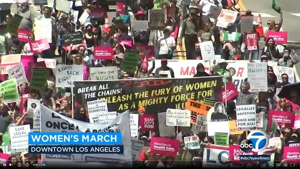 Bird's eye view of RU4AR April 15 march in Los Angeles on local news.