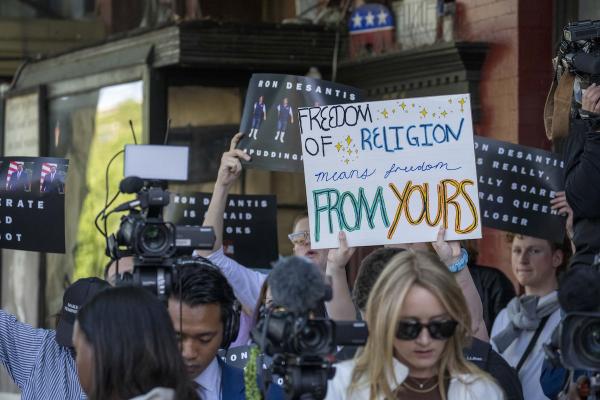 Protesters with sign: Freedom of Religion Means Freedom from Yours