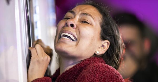 A migrant cries for someone she knows who was injured in the deadly fire inside a Ciudad Juárez, Mexico, detention center, March 27, 2023.