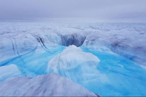 Melting of Greenland ice sheet in 2020; the Arctic is rapidly warming, adding to sea level rise.