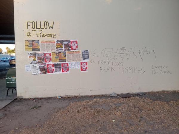 Revcom posters defaced with "fags, traitors, fuck commies"