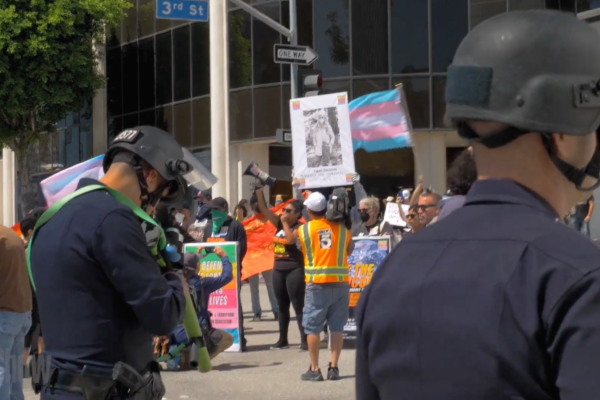 Revcoms defending the rights and lives of people under attack by anti-LGBTQ fascists in and out of government, at the Los Angeles Unified School District meeting.