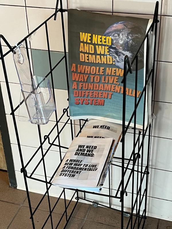 Houston, distribution stand for We Need We Demand at restaurant