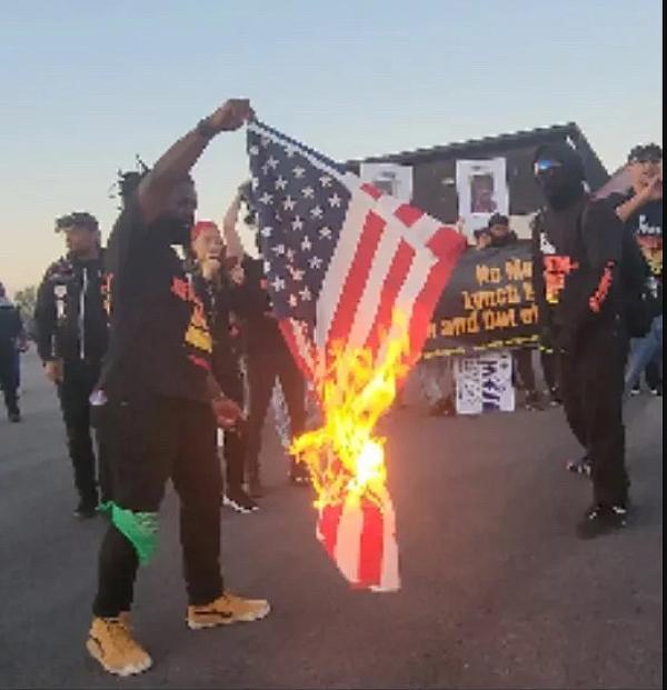 Revcoms set U.S. flag on fire at Jason Aldean concert in Tinley Park, Illinois.