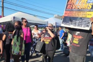 People turning their heads to hear the revcoms' message