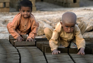 Two very young child laborers in a brick factory