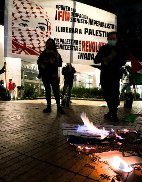 Revcoms in Bogota, Colombia, burning Israeli and U.S. flags in front of Israeli embassy, October 7, 2023.