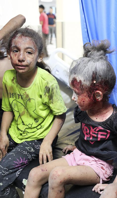 Palestinian children wounded by Israeli strikes in Gaza City, October 11, 2023.