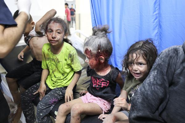 Palestinian children wounded by Israeli strikes in Gaza City, October 11, 2023.