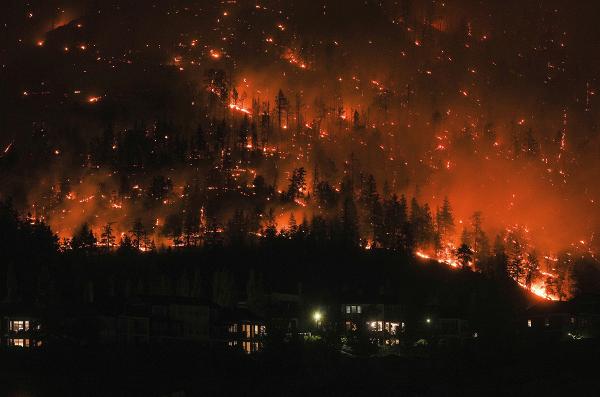 Wildfire burns in McDougall Creek, B.C., Canada, in worst fire season on record, August 18, 2023.