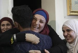 Released Palestinian prisoner embraced by family and friends