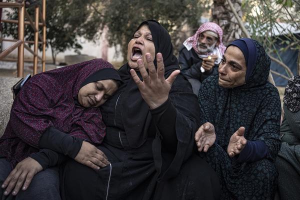 Palestinians mourn relatives killed in the Israeli bombardment of the hospital in Khan Younis. December 2, 2023