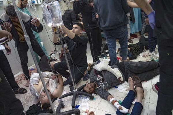 Palestinians being treated on the floor of the hospital in Khan Younis, Gaza Strip, December 5, 2023.