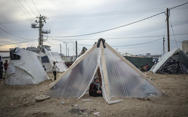 Displaced Palestinians in makeshift tents. Relief agencies have run out of tarps so people sleep under whatever debris they can collect.
