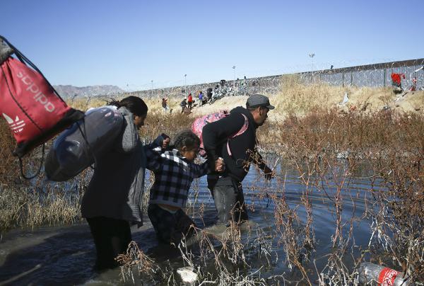 Migrants cross the Rio Grande to reach the United States from Ciudad Juarez, Mexico, December 27, 2023.
