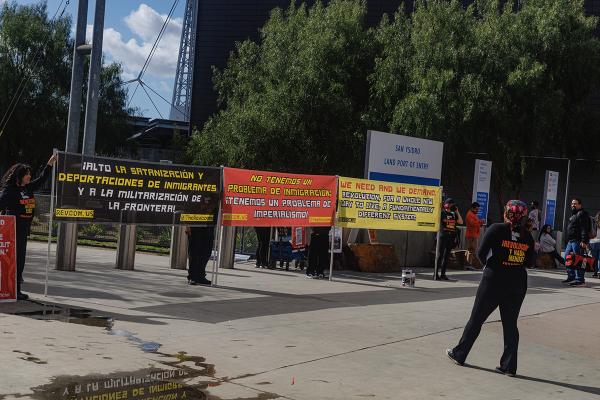 RevComs with banners at San Ysidro, California agitate about immigrants are not the problem, February 2, 2024.