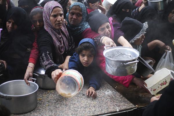 Starving Palestinians line up for food, February 7, 2024.