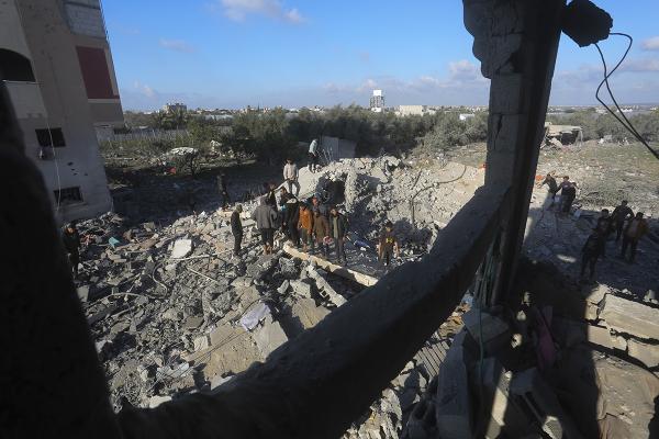 Palestinians search for survivors after an Israeli airstrike on a residential building In Rafah, Gaza Strip, February 10, 2024.
