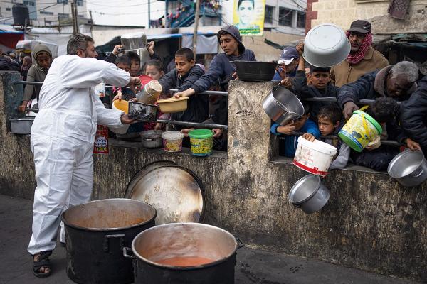 Palestinians line up for food in Rafah, Gaza Strip, February 23, 2024.