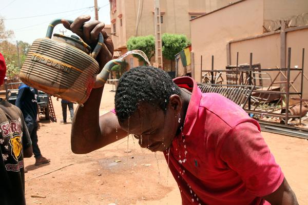 In the African country of Mali, one city reached 119 degrees, which may be the highest temperature ever recorded in Africa. This level of heat is deadly. People's liver and kidneys fail, and their brains swell. Here a welder, cools off with water in Bamako, Mali, April, 18, 2024. 