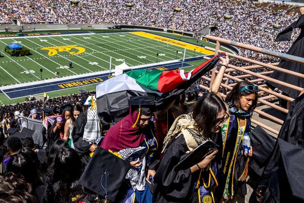 California: UC Berkeley students carry a Palestinian flag during commencement ceremony, May 11, 2024.