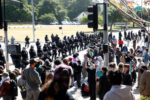 Police in riot gear stand off against pro-Palestinian demonstrators at the University of Santa Cruz, California, May, 31, 2024.
