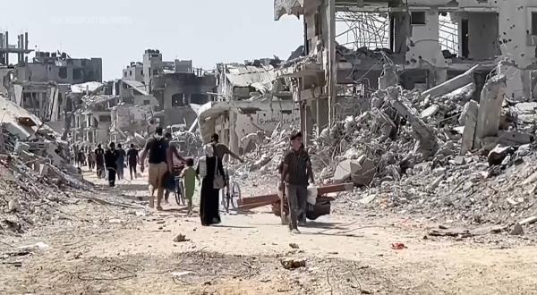 Palestinians inspect destruction in Gaza City's Shijaiyah neighborhood, July 11, 2024