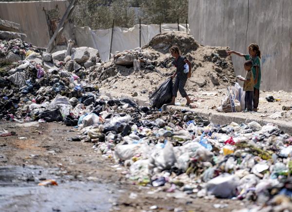 Gaza Strip: the concentration of polio virus in streams and piles of human waste is sufficient to infect children, such as those here who sort trash.