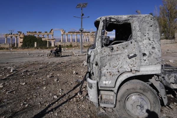 Truck damaged from Israeli airstrike in front of part of the Roman temples of Baalbek, November 28, 2024.