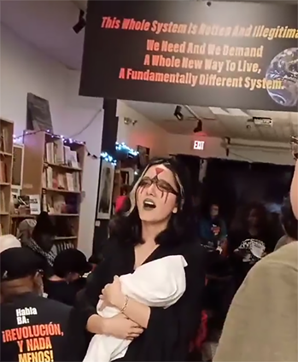 Las Lloronas, women carrying shrouds representing children in Gaza at NYC Revolution Books