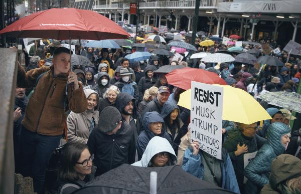 New York City people in the rain at the "Hands Off!" protest against President Donald Trump on April 5, 2025