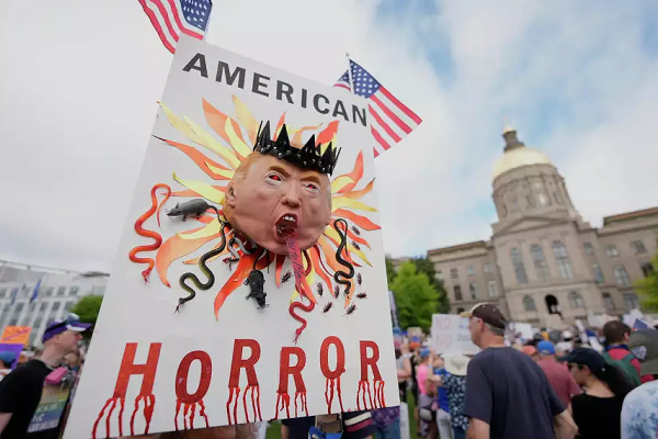 Atlanta protest on No Kings Day, large image of Trump horror, June 14, 2025.