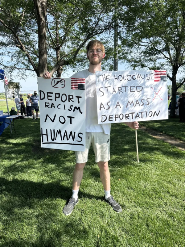 Omaha No Kings protest sign: "The holocaust started as a mass deportation."
