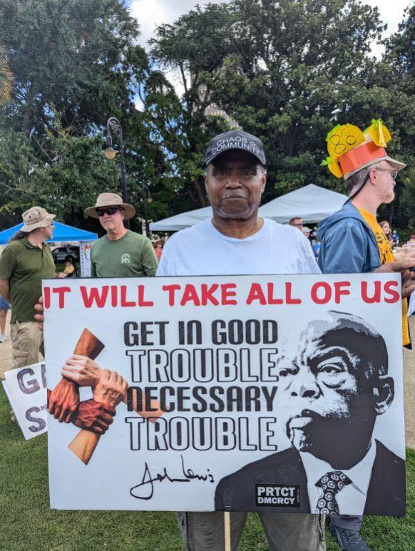 Sign at South Carolina Good Trouble rally: It will take all of Us.