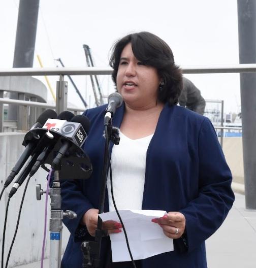 Maya Suzuki Daniels speaking at Terminal Island in Los Angeles  Country against attacks on immmigrants