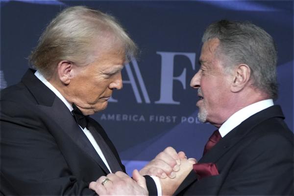 Donald Trump greets actor Sylvester Stallone during an America First Policy Institute, November 14, 2024.