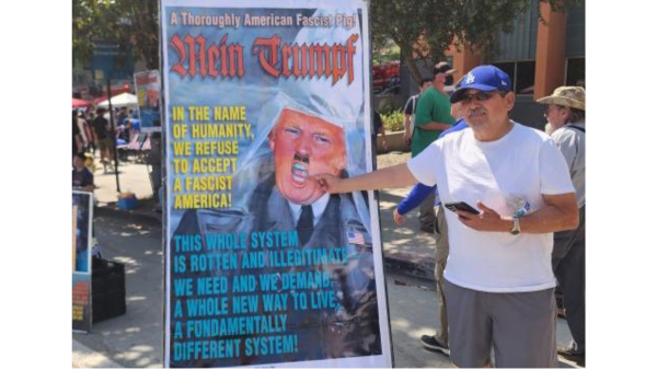 Man inspired by the poster to say Fuck Donald Trump!