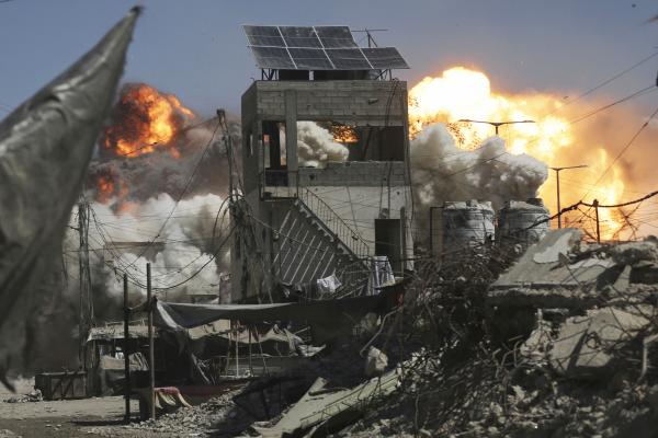 Smoke and flames from an Israeli military strike on a building in Gaza City, September 13, 2025.