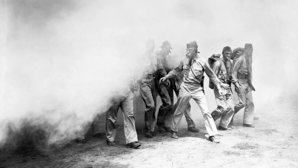 U.S. troops in Panama participate in a chemical warfare training exercise with smoke during World War II.