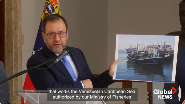 Venezuelan foreign minister shows a photo of the fishing boat boarded by the U.S. Navy, September 13, 2025.