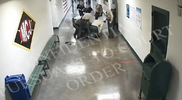 Sheriffs Deputies kneeling on inmate's neck at LA Men's Central Jail, 2012.