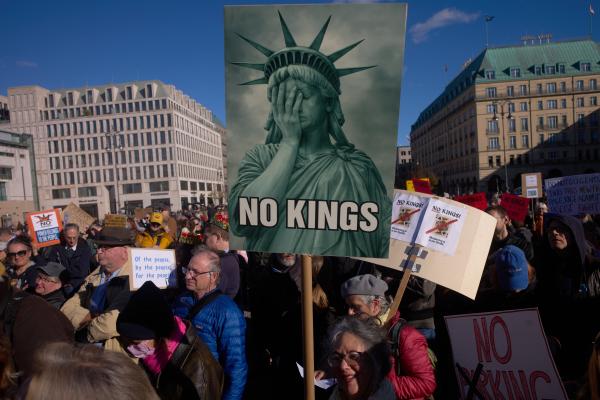 Berlin, woman with No Kings sign, October 18, 2025.