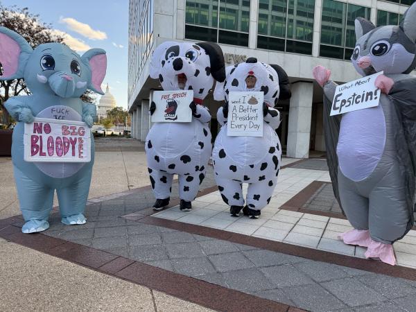 Halloween characters with anti-Trump signs, October 31, 2025.